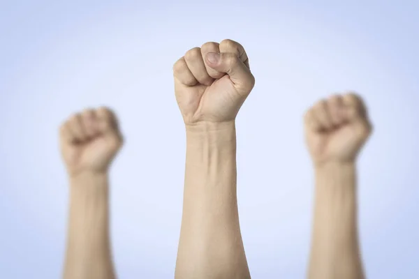 Male Hands Clenched Fist Raised Blue Background Concept Power Rebellion — Stock Photo, Image
