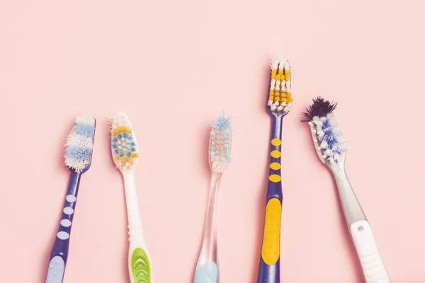 Several Different Used Toothbrushes Pink Background Toothbrush Change Concept Oral — Stock Photo, Image