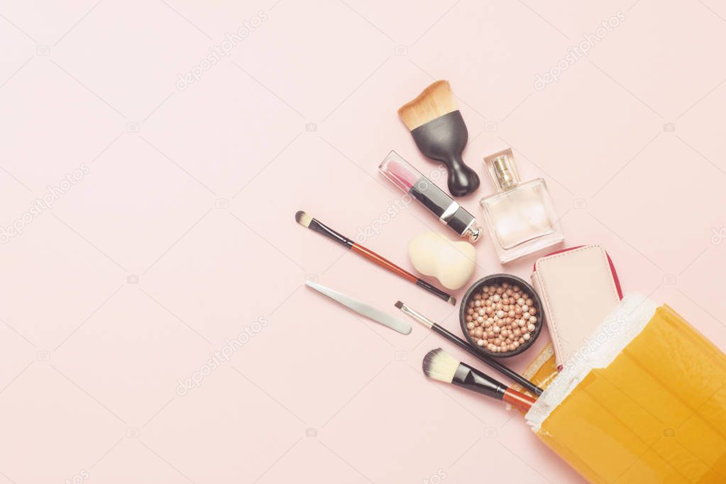 Unpacked delivery package with goods on a pink background. Concept parcel, cargo, order from China, a variety of products, online store, skin care cosmetics and makeup. Flat lay, top view