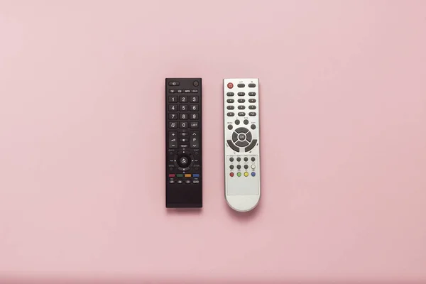 Telecomandi Grigi Neri Sfondo Rosa Concetto Televisione Film Spettacoli Televisivi — Foto Stock