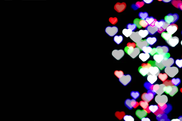 Siyah Arka Planda Çok Renkli Bokeh Kalp Şeklinde Aşk Konsepti — Stok fotoğraf