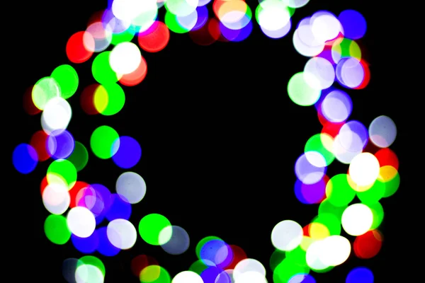 Multicolored bokeh on black background. Can be used as a background or wallpaper. Circle shape