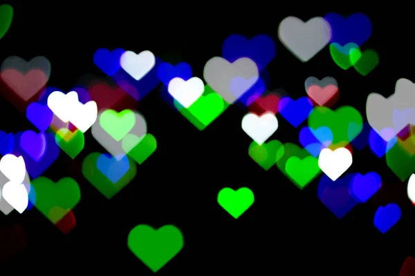 Siyah Arka Planda Çok Renkli Bokeh Kalp Şeklinde Aşk Konsepti — Stok fotoğraf