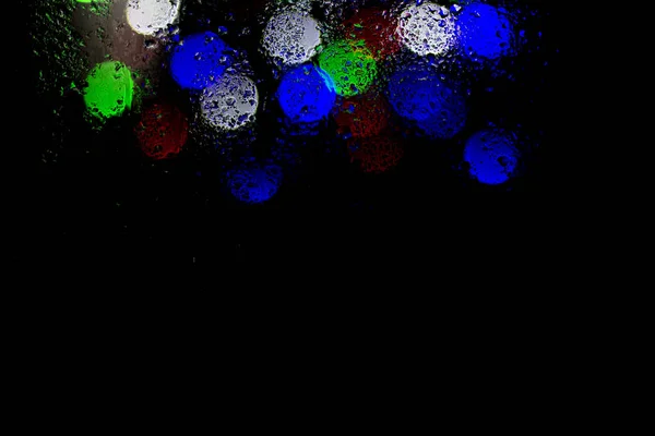 Bokeh Nacht Stadt Lichter Hinter Nassem Glas Bei Regen Kann — Stockfoto