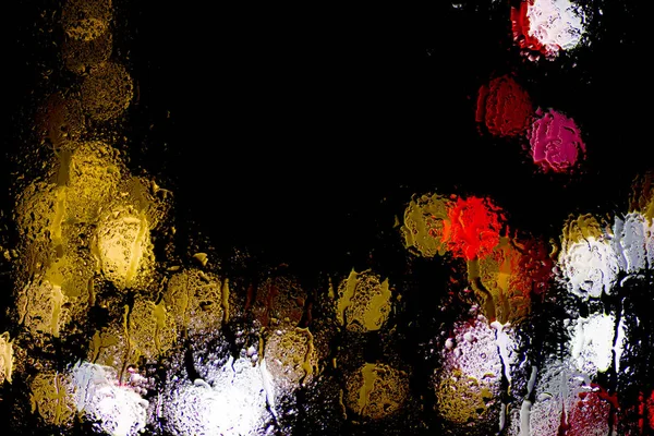 Bokeh Nacht Stadt Lichter Hinter Nassem Glas Bei Regen Kann — Stockfoto