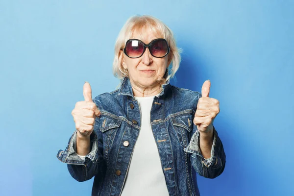 Old lady in sunglasses top