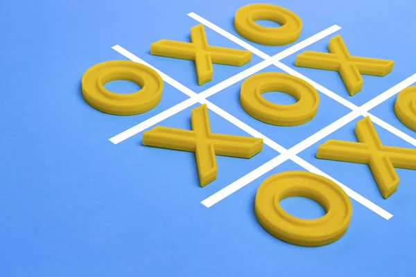 Yellow plastic crosses and a toe and a ruled field for playing t — Stock Photo, Image