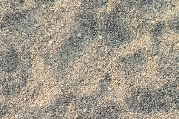 해변 모래. 작은 돌과 모래의 질감. 로 사용할 수 있습니다. — 스톡 사진