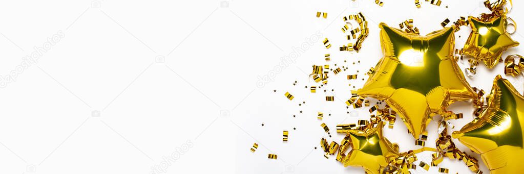 Air golden balloons star and confetti shape on a white background. Concept of a holiday, party, birthday, decoration. Banner Flat lay, top view.