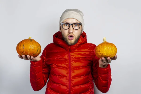 Surprised Young Man Red Jacket Hat Holds Two Pumpkins Light — Stock Photo, Image