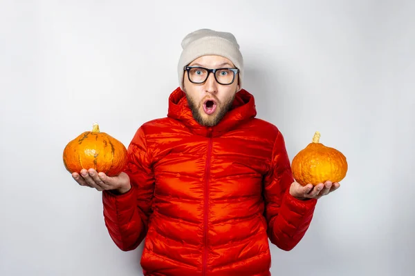 Surprised Young Man Red Jacket Hat Holds Two Pumpkins Light — Stock Photo, Image