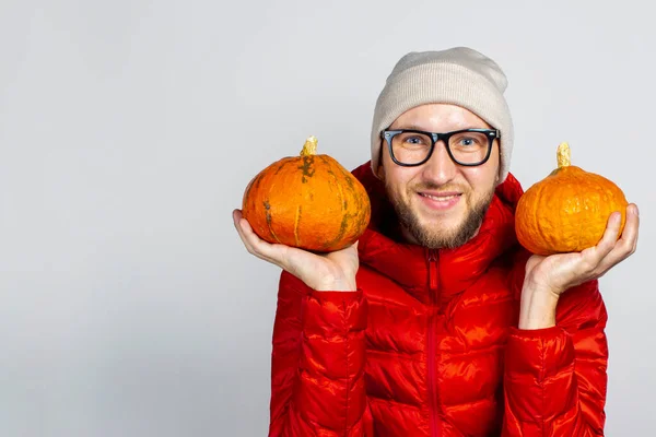 Happy Young Man Red Jacket Hat Holds Two Pumpkins Light — Stock Photo, Image