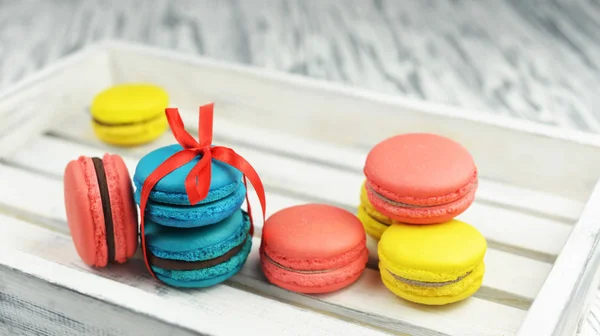 Macaroons sweet tasty cookies with red bow French almond — Stock Photo, Image