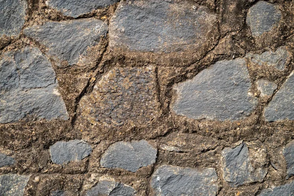 Taştan bir duvar büyük taştan. Arka plan.