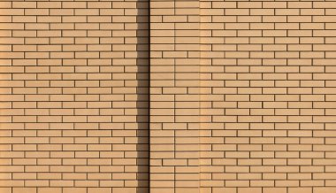 Merkezinde bir sütun ile modern yeni düz bej tuğla duvar. Soyut modern trendy doku arka plan