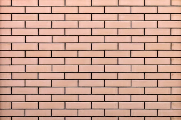 Nieuwe bakstenen muur gemaakt van beige massief baksteen met zwarte cement naad. Moderne abstracte achtergrond — Stockfoto