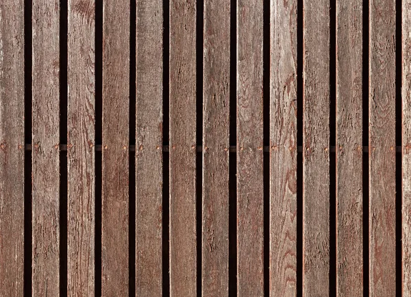 Vecchio recinto in legno rustico abbandonato. Tavole strutturate con vernice peeling. Trendy sfondo moderno . — Foto Stock