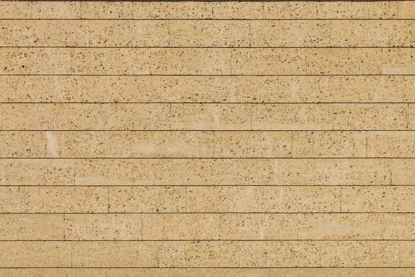 Giallo mattone poroso parete texture sfondo — Foto Stock
