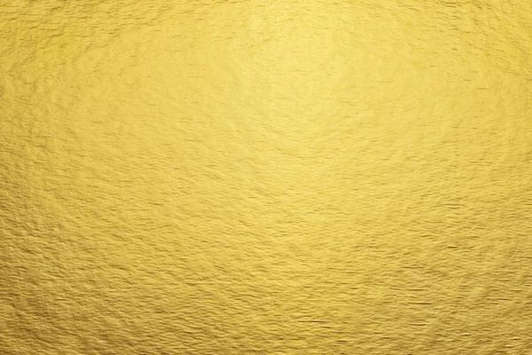 Vista superior primer plano dorado brillante lámina de cartón. Fondo abstracto de textura moderna de moda —  Fotos de Stock