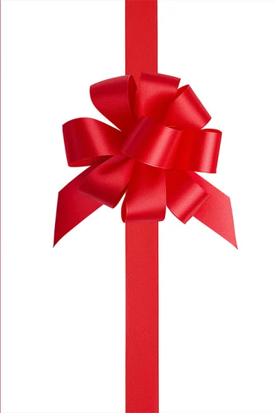 Top view of a gift tied with a red satin bright shiny vertical ribbon and an unusual big red bow with a lot of loops isolated on white background — Stock Photo, Image