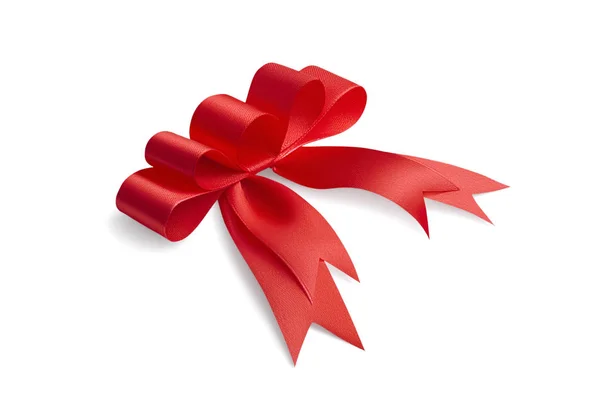 Side view of an unusual creative handmade beautiful holiday gift bow made of red satin shiny bright ribbon with five loops isolated on white background — Stock Photo, Image