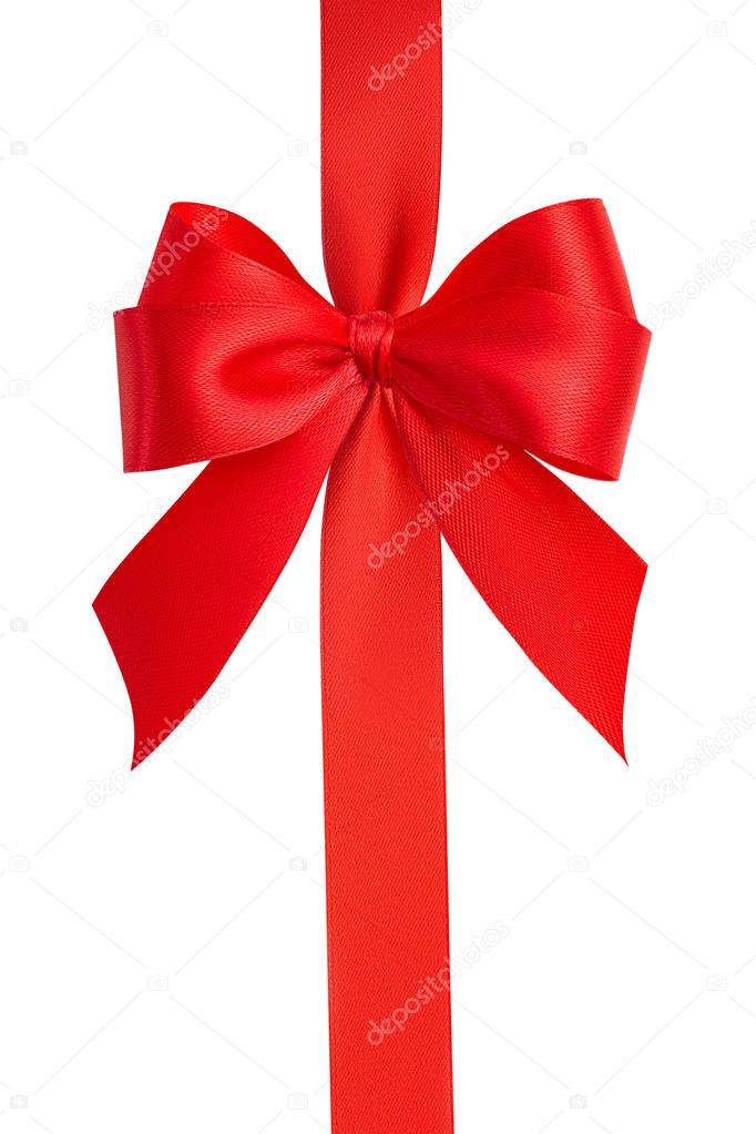 Top view of a beautiful large fashionable ornate red bow and bright red silk vertical ribbon isolated on white background. Gift wrapping concept. Close up, clipping path