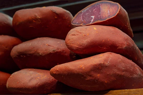 Pork dried meat . Dried pork prosciutto salami ham with herbs.