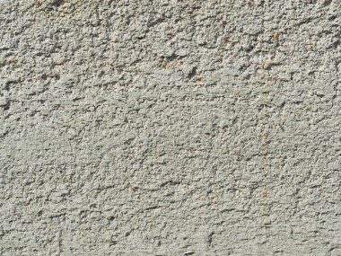 Açık gri, pürüzsüz beton duvar dokusu. Arkaplan olarak kullanılabilir