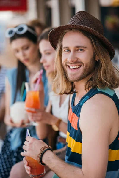 Handsome Young Man Smiling Camera While Drinking Cocktail Friends Beach — Free Stock Photo