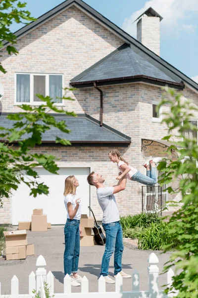 Side View Father Raising Daughter While Mother Standing Front New — Stock Photo, Image