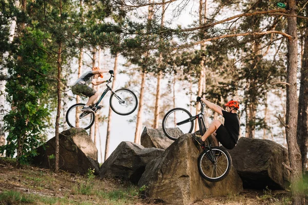 Active Trial Bikers Performing Stunts Rocks Outdoors — Stock Photo, Image