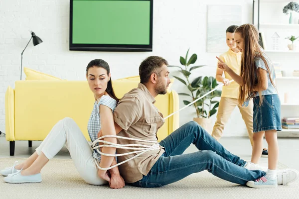 Children Tying Parents Rope Floor Home Parenthood Concept — Stock Photo, Image