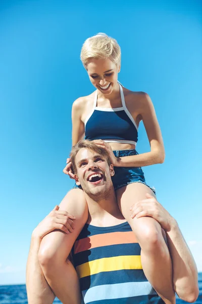 Low Angle View Young Woman Sitting Boyfriends Shoulders Clear Blue — Stock Photo, Image