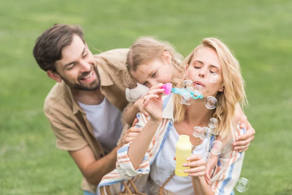 Happy Family One Child Having Fun Together Blowing Soap Bubbles — Stock Photo, Image