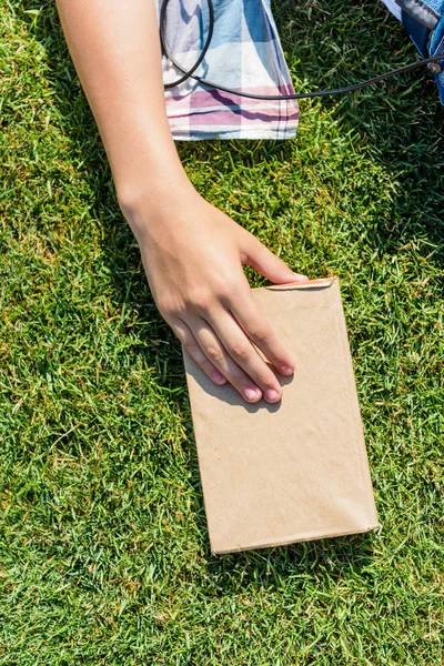 Cropped Shot Person Holding Book Blank Cover Green Grass — Stock Photo, Image