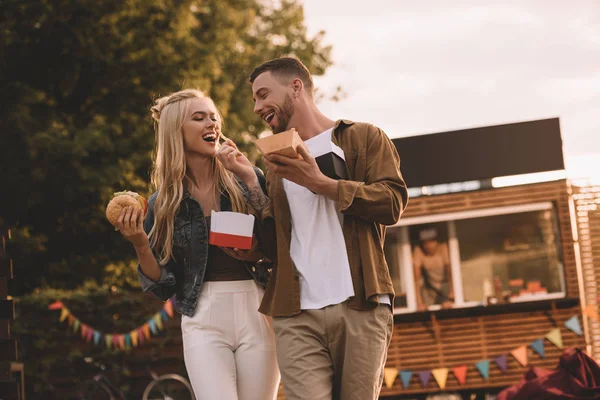 Low Angle View Boyfriend Feeding Girlfriend French Fries Food Truck — Stock Photo, Image