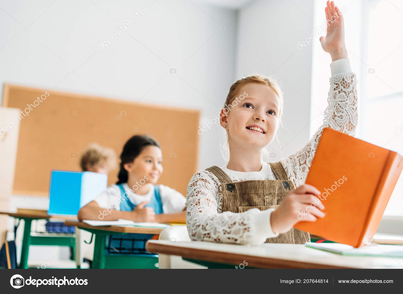 Schoolgirl Raising Hand Answer Teachers Question Lesson Stock Photo by  ©ArturVerkhovetskiy 207644814
