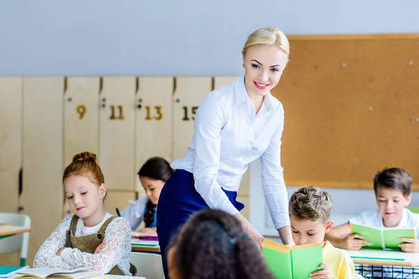 Happy Teacher Checking How Kids Reading Books Lesson — Stock Photo, Image