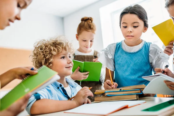 Schoolchildren Writing Homework Classmate Break — Stock Photo, Image