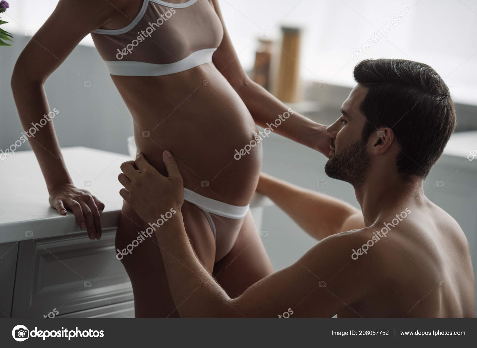 Partial View Man Looking Pregnant Wife Underwear Kitchen Home Stock Photo by ©ArturVerkhovetskiy 208057752