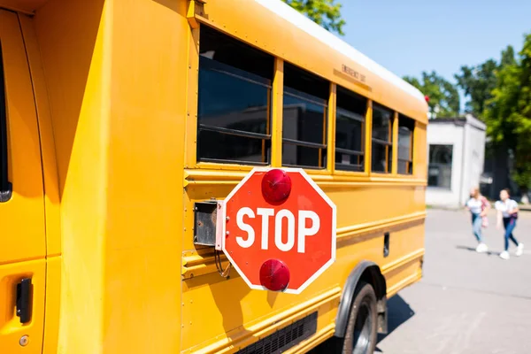 Partial View School Bus Stop Sign Standing Parking Blurred Students — Stock Photo, Image