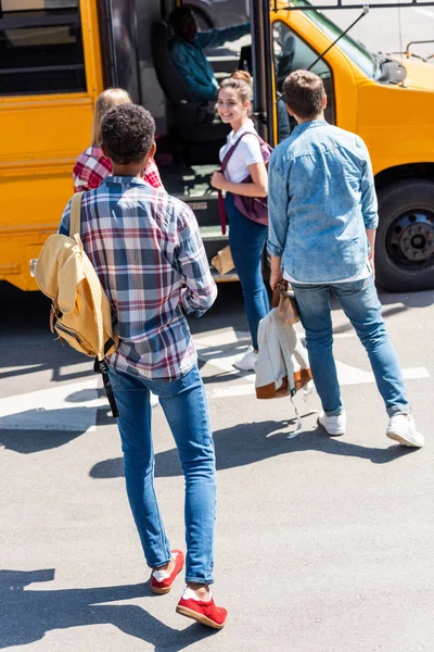 Rear View Group Teen Scholars Walking School Bus School — Stock Photo, Image