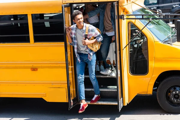 African American Teen Schoolboy Walking Out School Bus Classmates — Stock Photo, Image