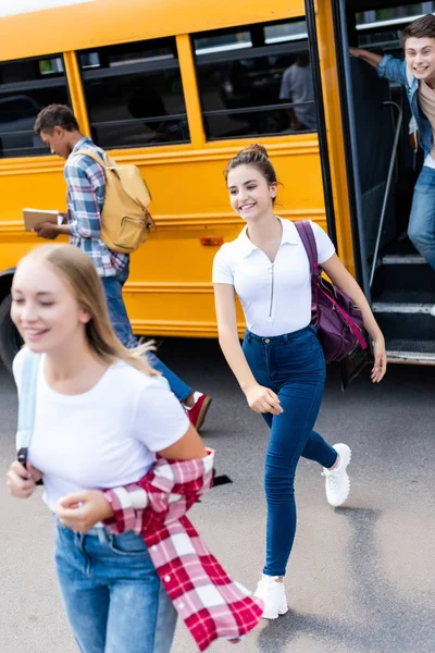 Group Multiethnic Teen Scholars Running Out School Bus — Stock Photo, Image
