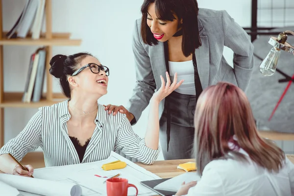 Smiling Young Businesswomen Discussing Project Working Blueprint Office — Stock Photo, Image