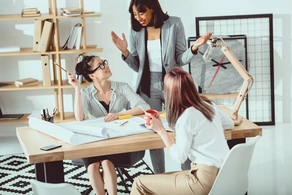 Smiling Young Businesswomen Working Blueprints Modern Office — Stock Photo, Image