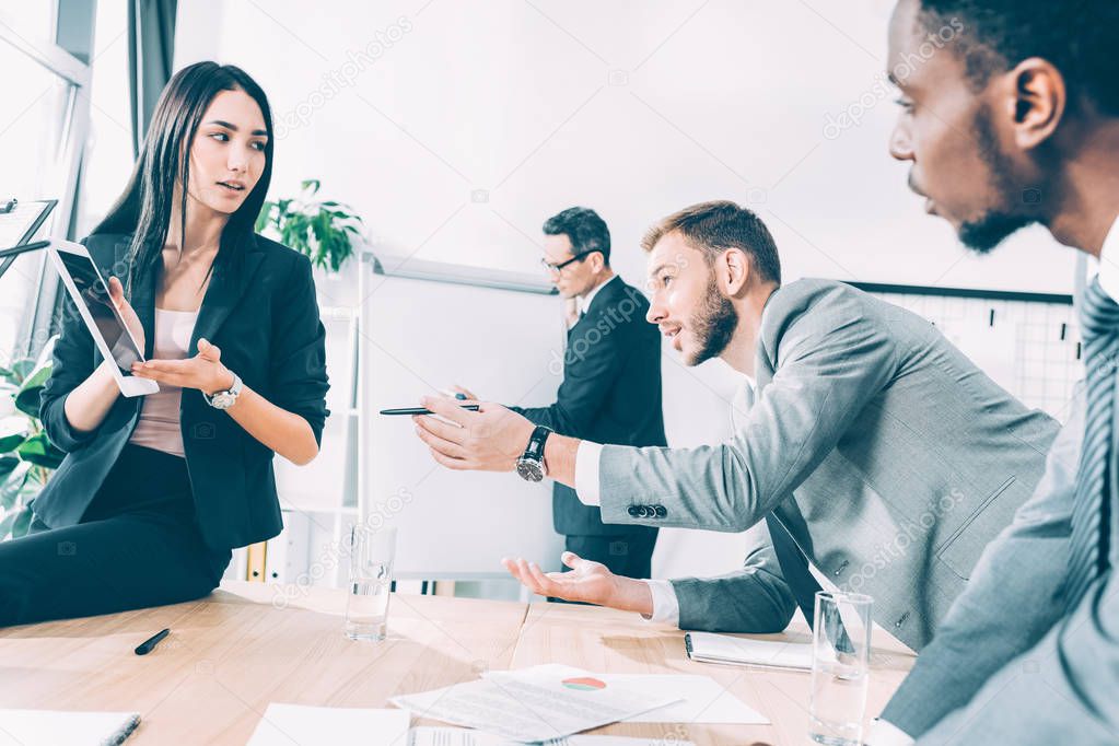 multiracial business parters having conversation at conference hall