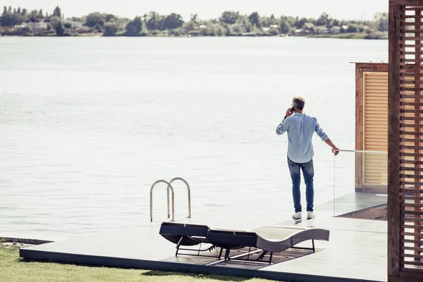 Rear View Adult Man Talking Smartphone Lake Country House — Stock Photo, Image