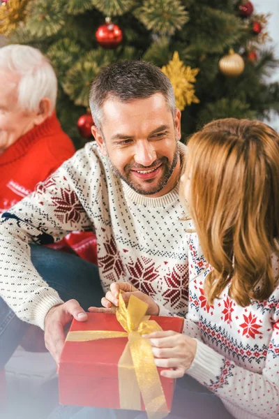 Handsome Young Man Presenting Christmas Gift His Wife — Stock Photo, Image