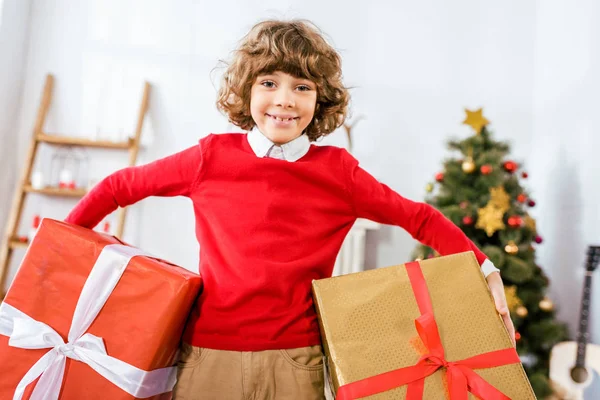 Adorable Happy Kid Holding Big Christmas Boxes Looking Camera — Stock Photo, Image